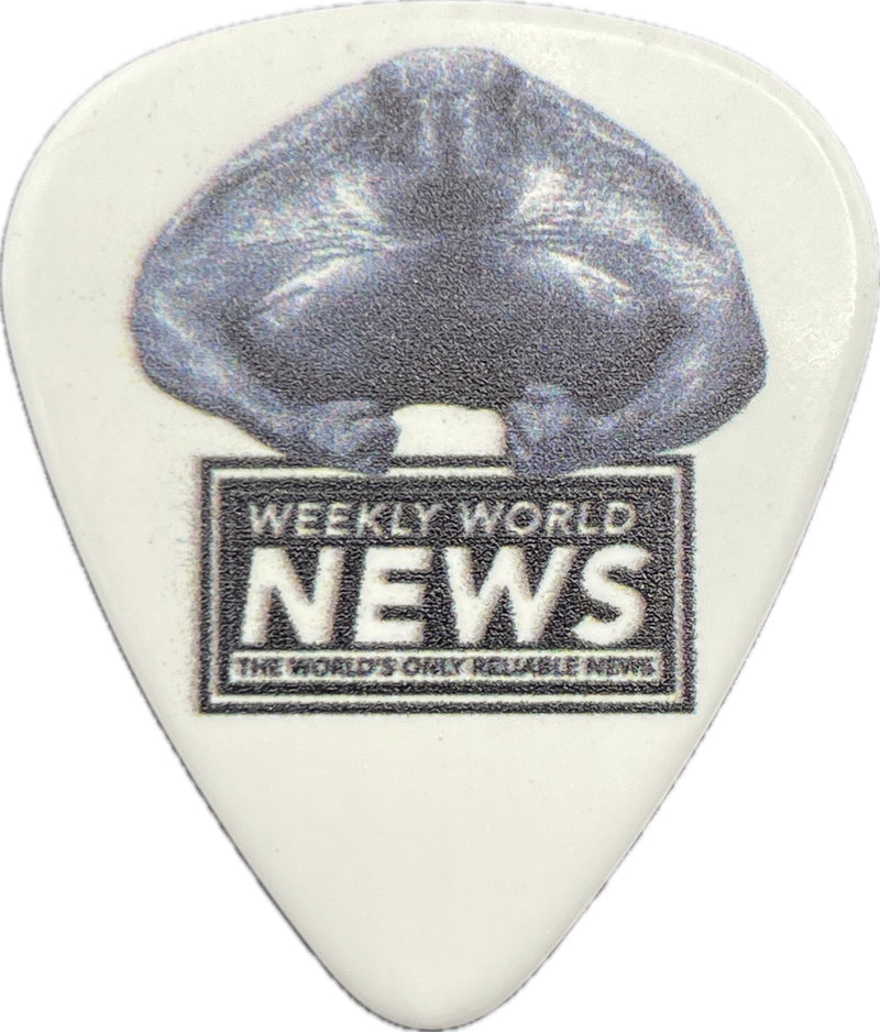 Weekly World News sea turtle artwork on a white guitar pick Weekly World News sea turtle artwork on a white guitar pick