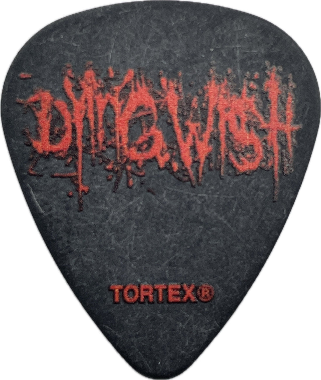 Front of a black Dying Wish Tortex guitar pick with red Dying Wish logo and Dunlop Tortex mark