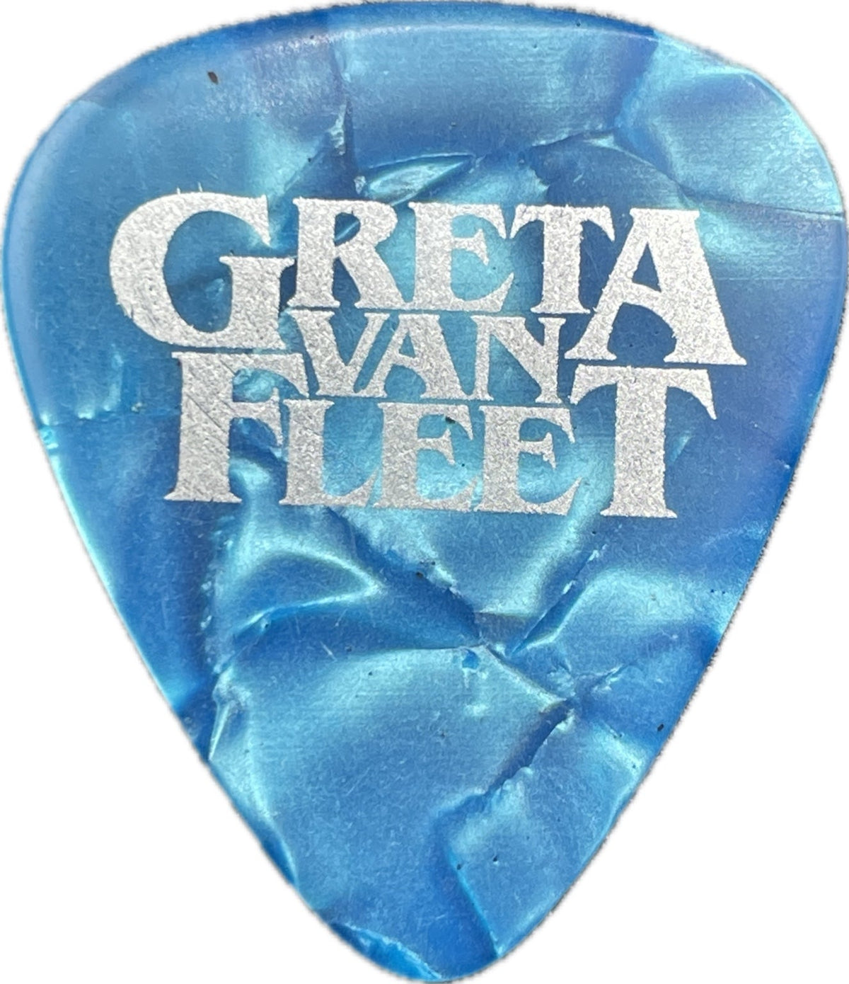 Front of a blue pearloid Greta Van Fleet guitar pick with white Greta Van Fleet lettering