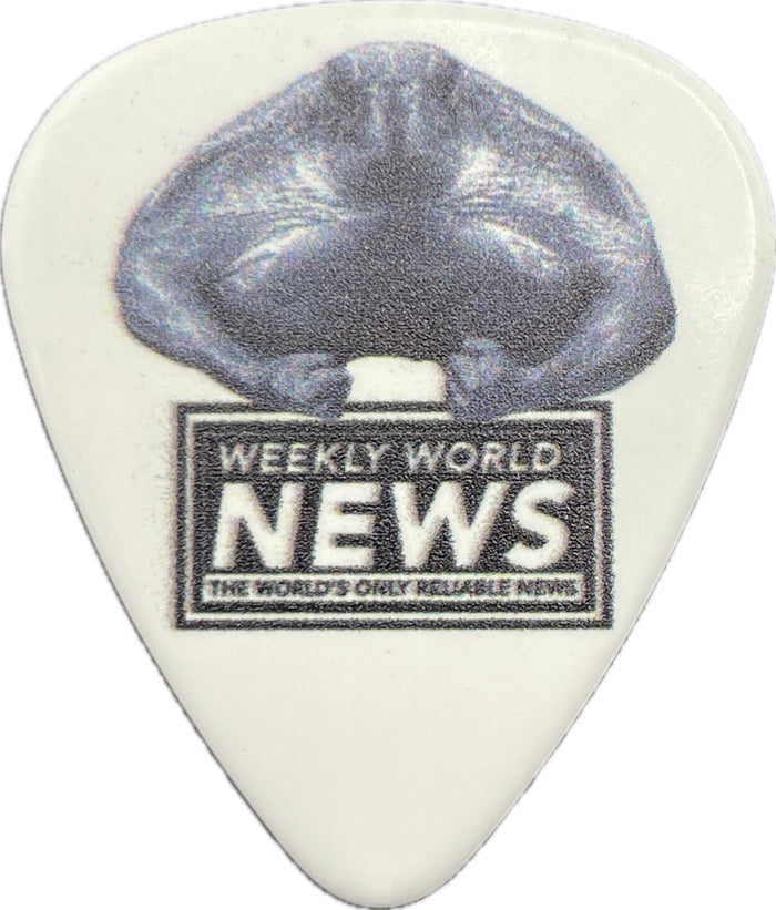 Weekly World News sea turtle artwork on a white guitar pick