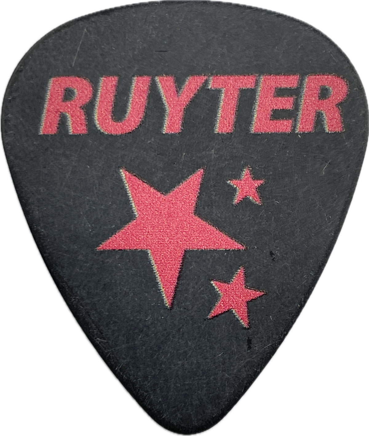 Reverse of black Ruyter Suys Nashville Pussy guitar pick with pink RUYTER lettering and star graphics reverse